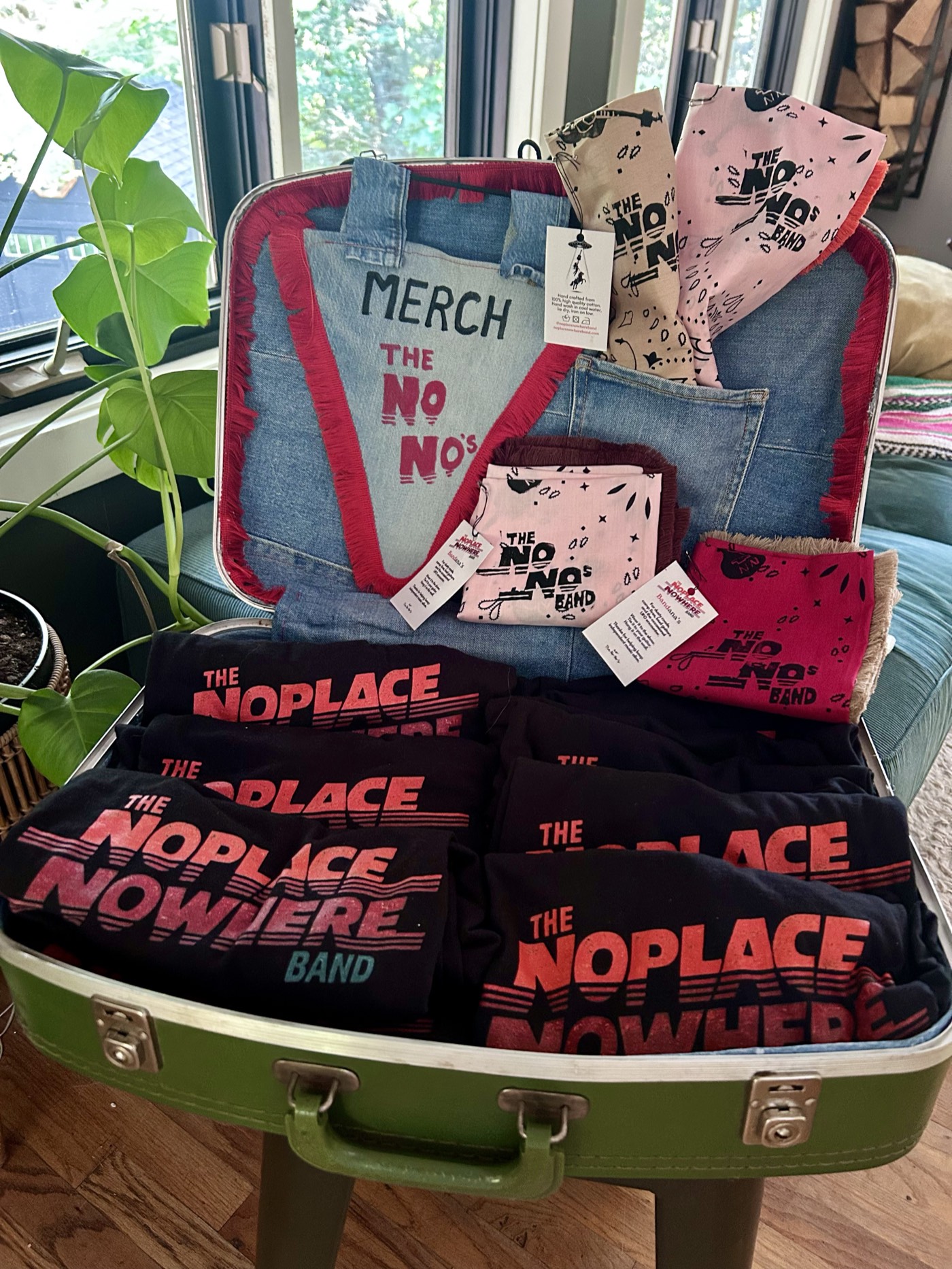 The band's merch case: t-shirts and hand-printed bandanas